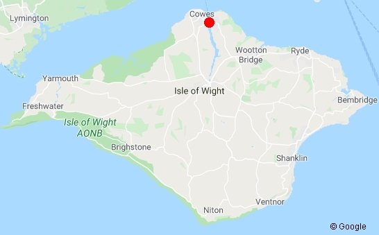 Map showing the Isle of Wight with a red dot marking Cowes at the northern tip.