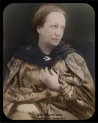 A woman dressed in vintage clothing, looking to the side with a solemn expression, holding her hand close to her chest.