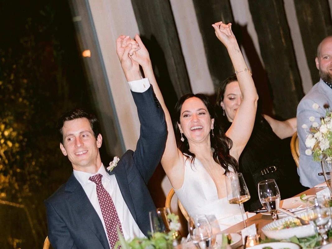 Couple celebrating together during their New York wedding after working with a wedding planner.