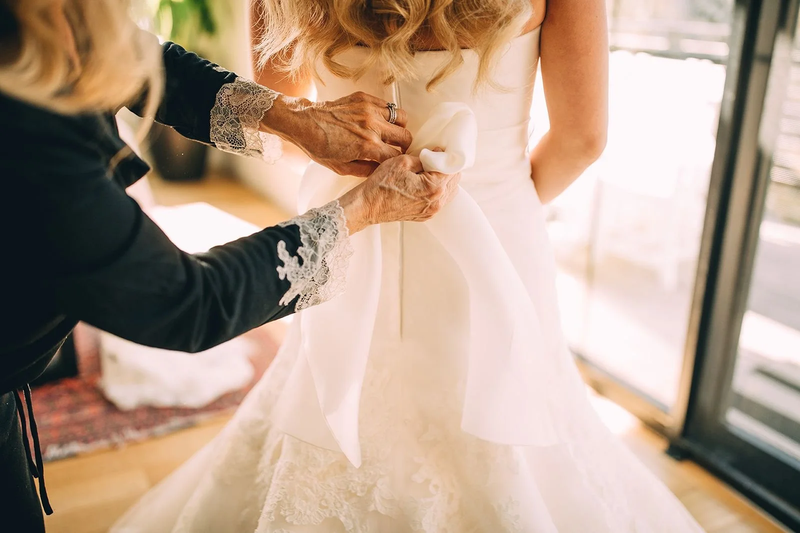 Bride getting ready on wedding morning with natural light