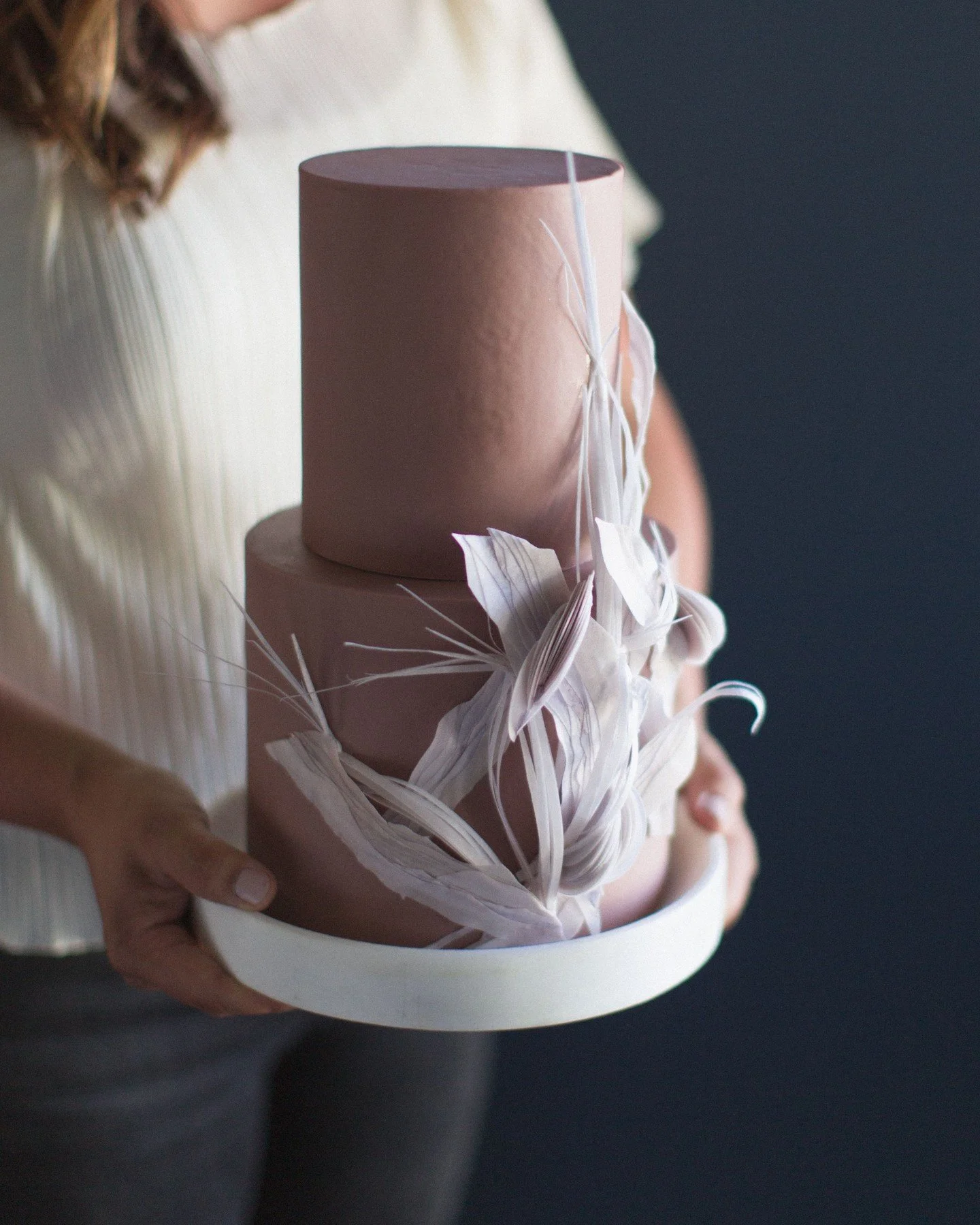 A wedding cake might look like one beautiful detail.

But as a planner, I'm looking at everything around it too.

Where will it be displayed?

What will be behind it?

Does the design make sense with the florals, linens, stationery, and overall direc