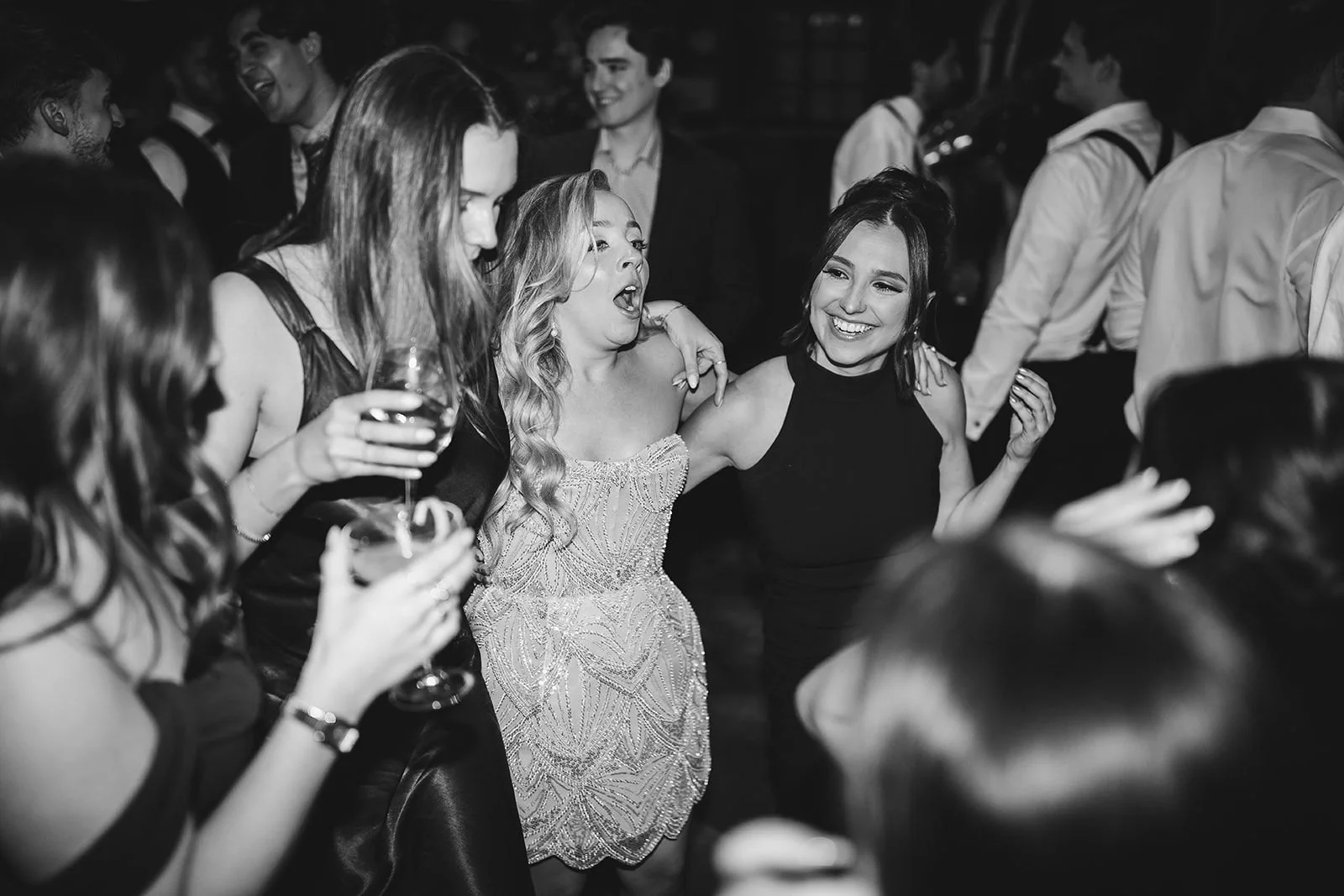 Bride spending time with guests during cocktail hour at a wedding