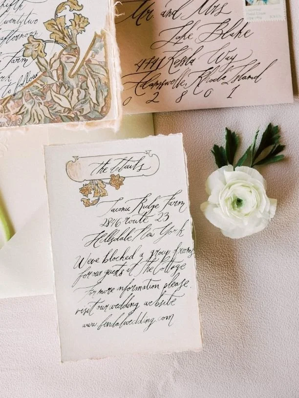 A handwritten letter with decorative floral elements, an outdoor wedding invitation with elegant calligraphy, and a white flower with green leaves on a soft pink surface.