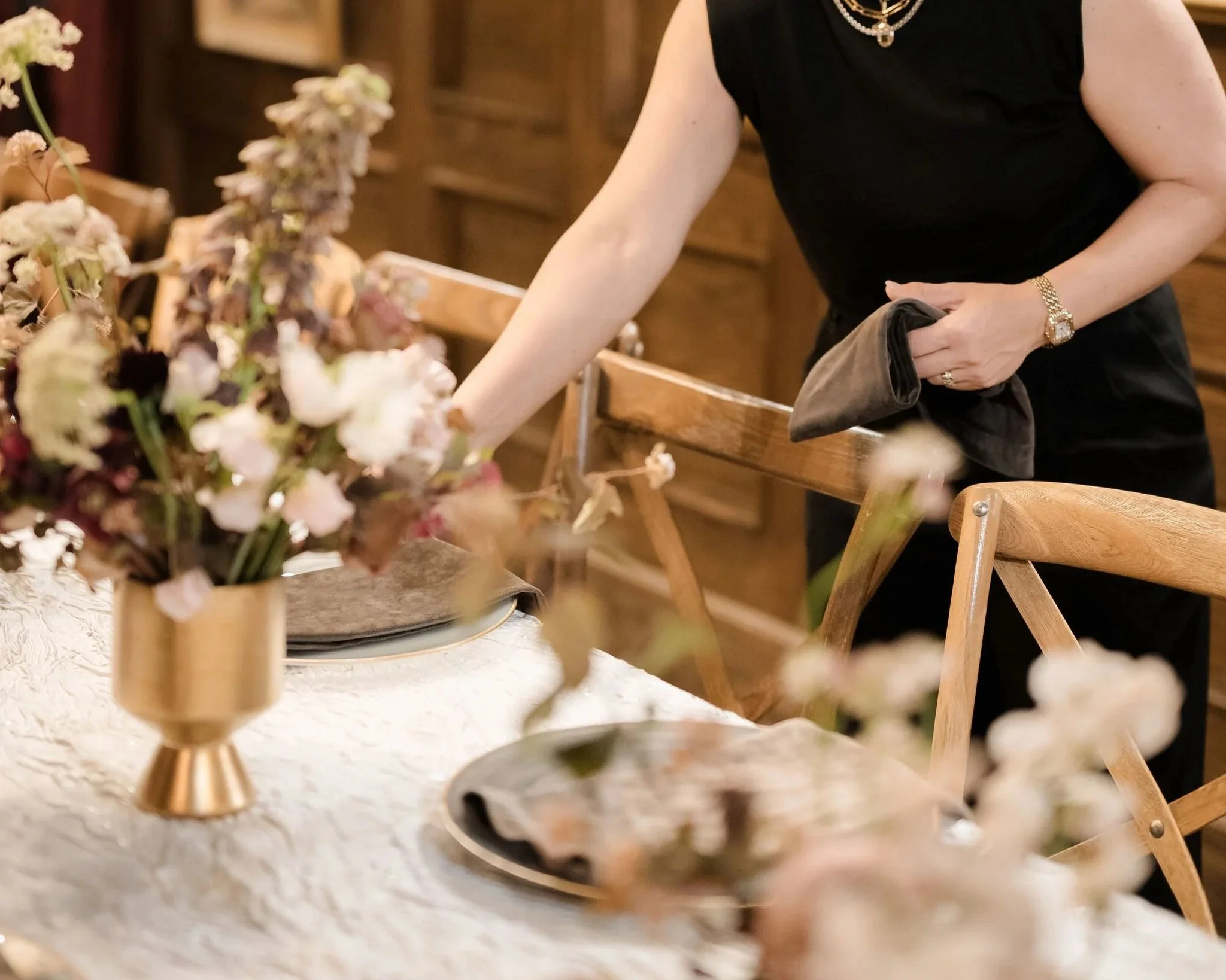 Wedding planner preparing reception details before guests arrive at a New York wedding.
