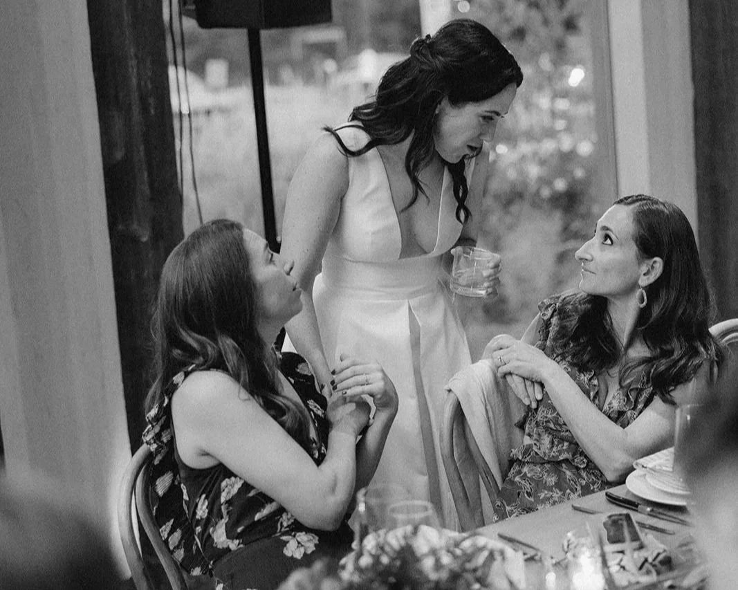 Bride talking with guests during an intimate wedding planned by Margo Events.