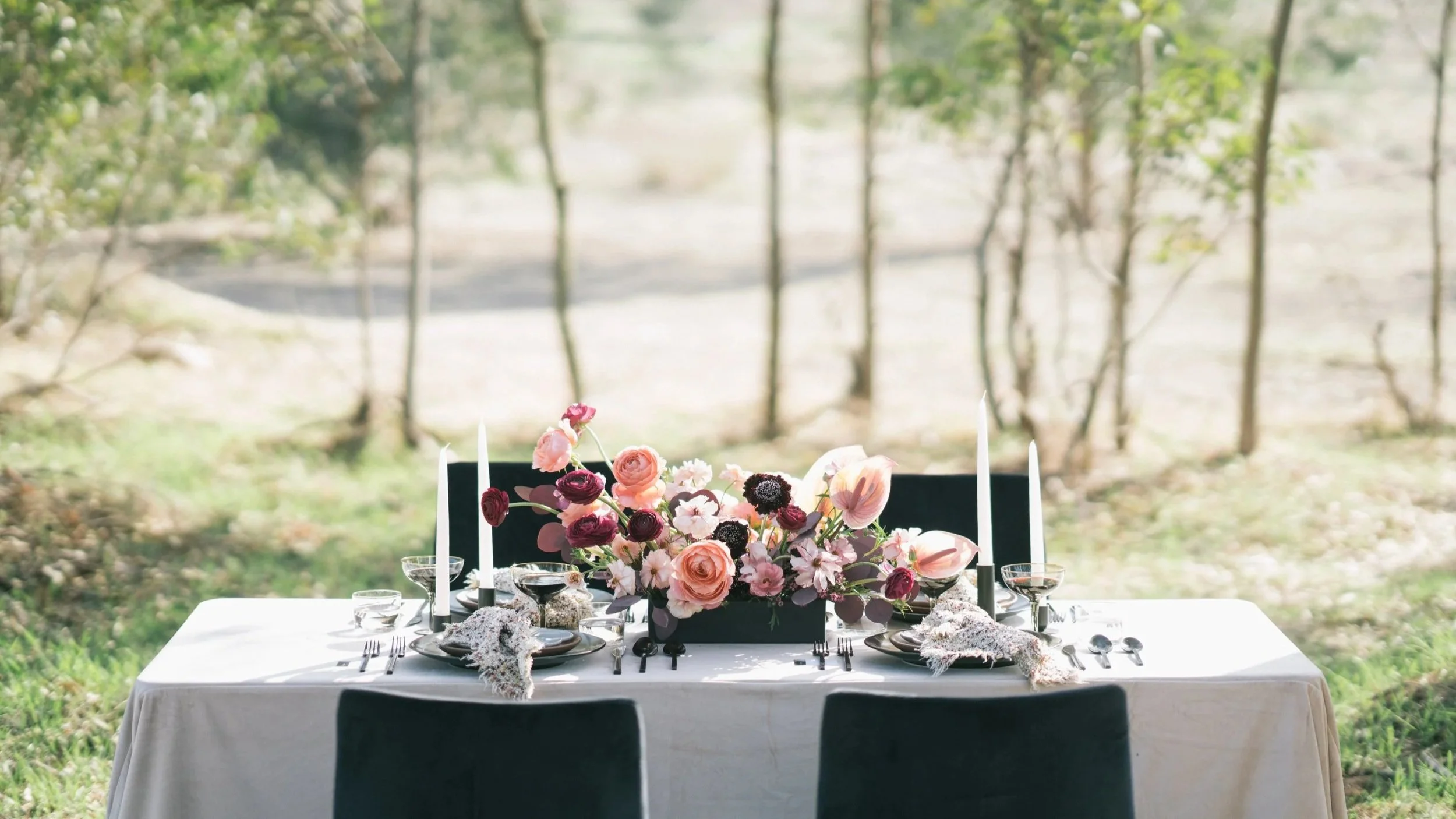 Hudson Valley wedding reception table with floral centerpiece and outdoor setting