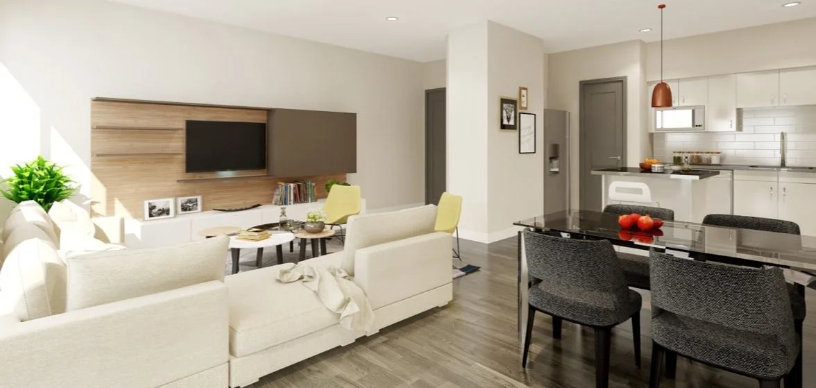 Interior view of a unit showing the living room, dining area, and kitchen with modern finishes.