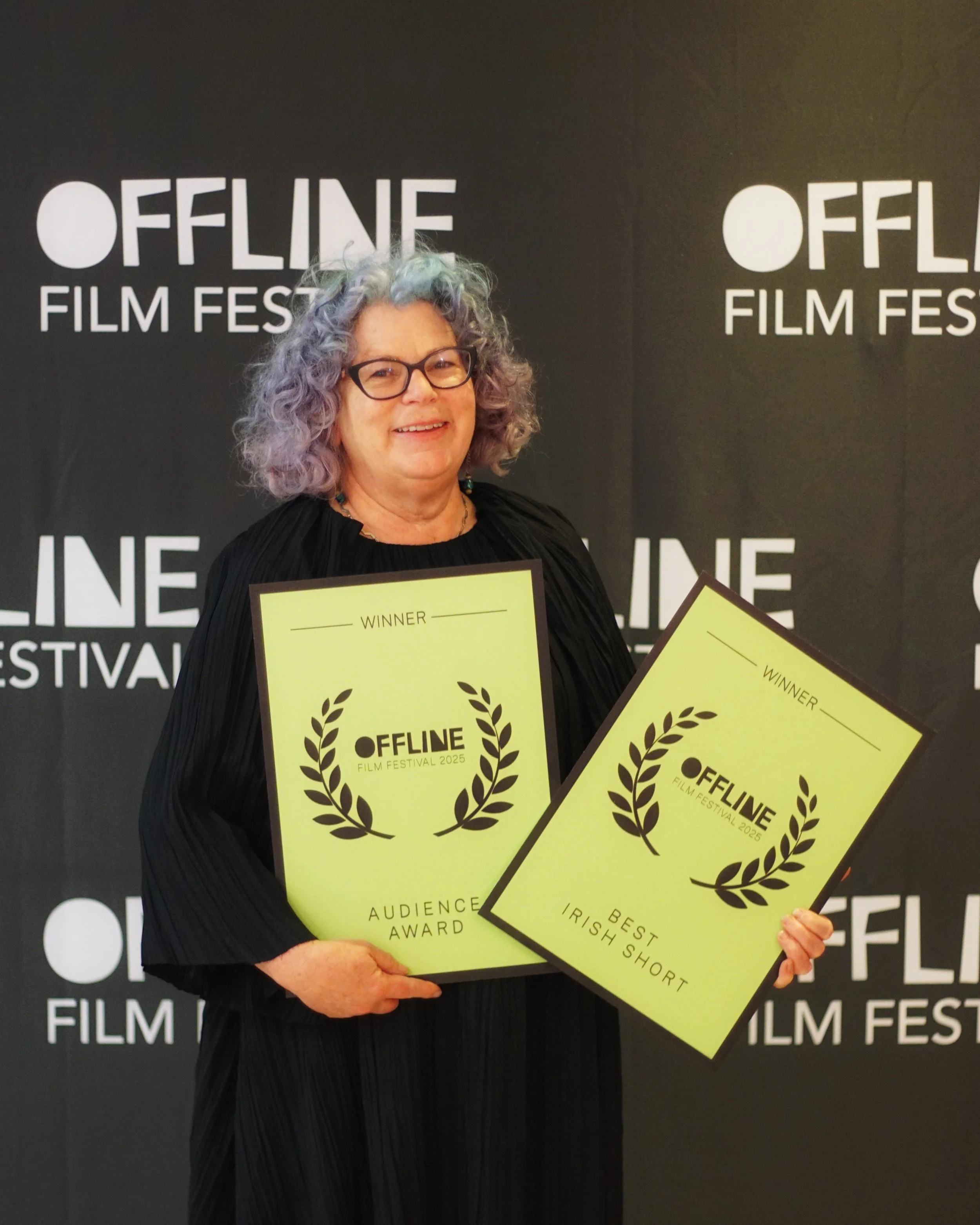 OFFline Film Festival 2025’s winner of Best Irish Short AND Audience Award, “Boobs”
Director: Nicola Leddy
Pictured accepting the awards is one of participants in Geraldine Carton’s project, Anna Browne.