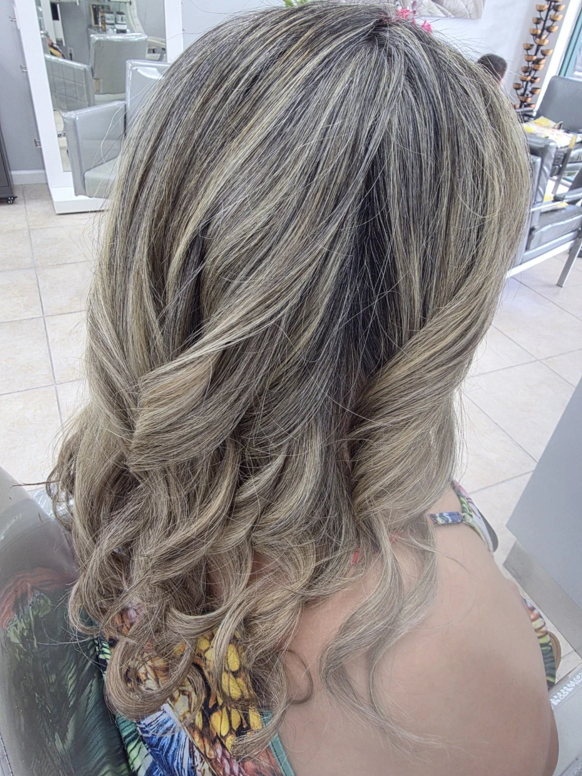 Dimensional highlights with curls at Luxury Hair Studio II