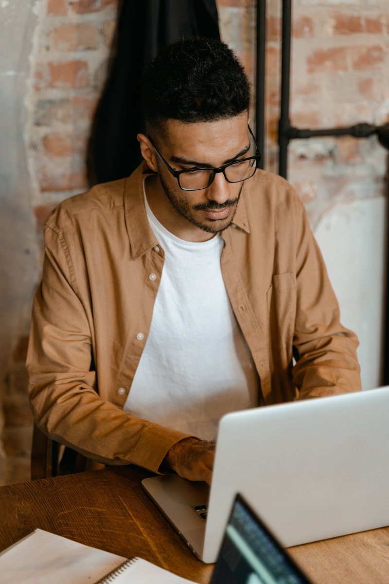 Man sitting at desk on computer