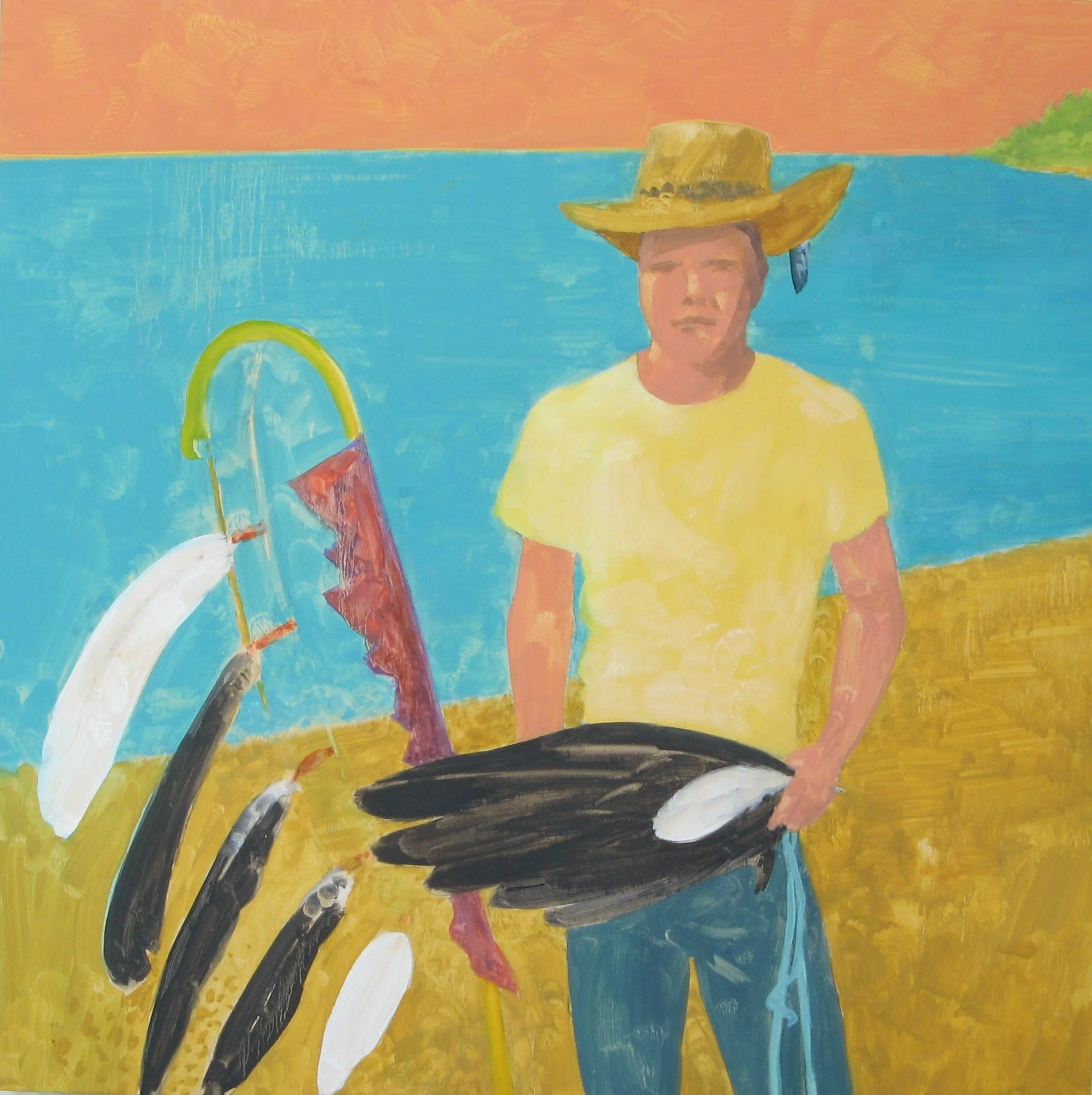 Indigenous young man stands along shore.