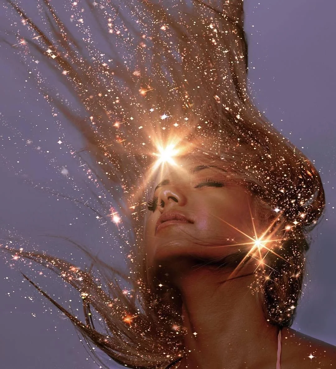 A woman with hair flowing in the wind, surrounded by sparkling stars and light effects, creating a dreamy, celestial appearance.
