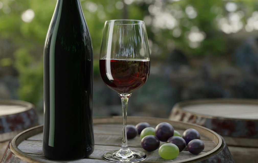 Glass of wine, bottle and grapes on a wine barrel