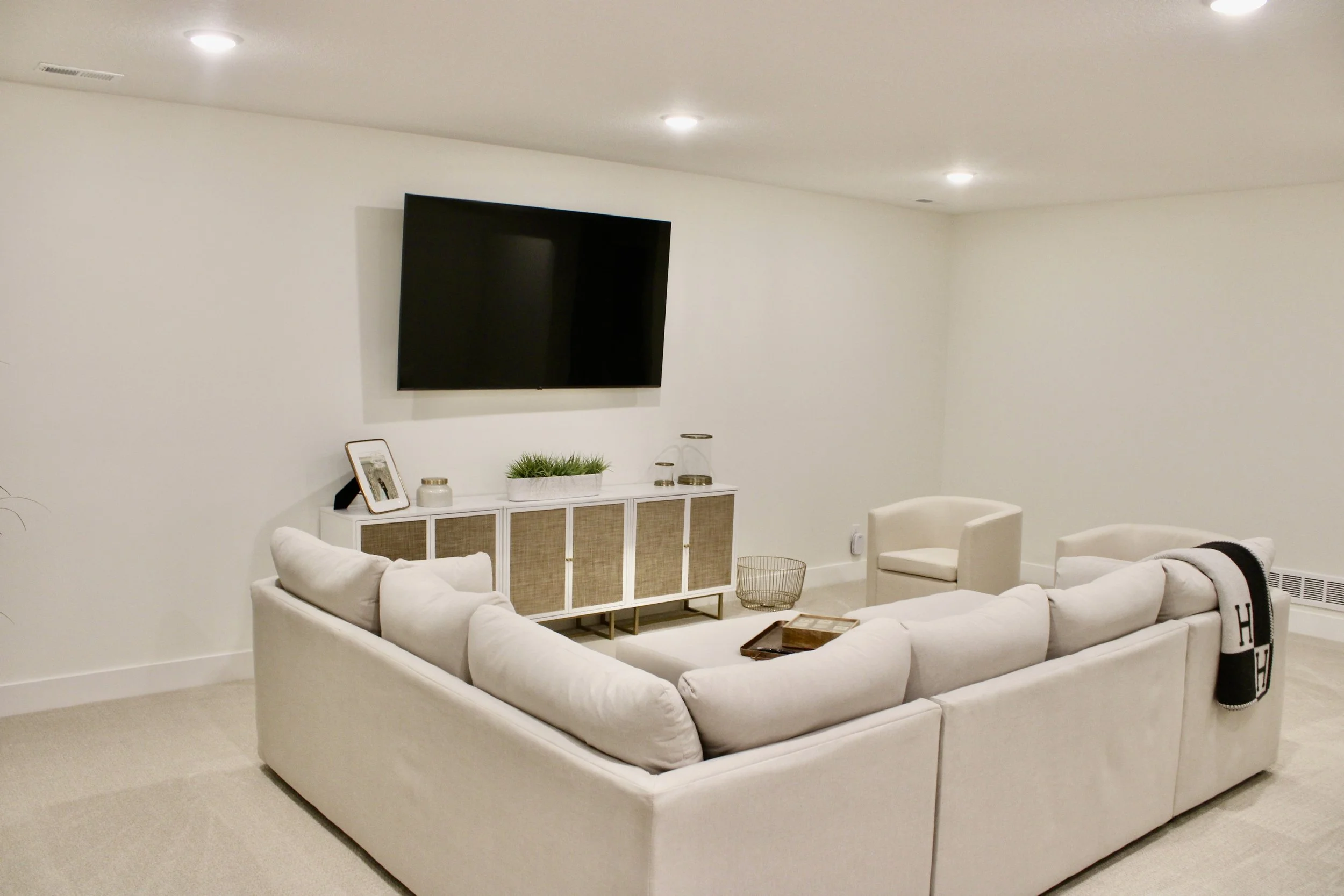 Freshly painted living room with smooth walls, crisp white trim, and clean cut lines

Professional interior painting of living room walls in warm neutral color

Before and after living room painting transformation by Mission Painting

Bright modern l