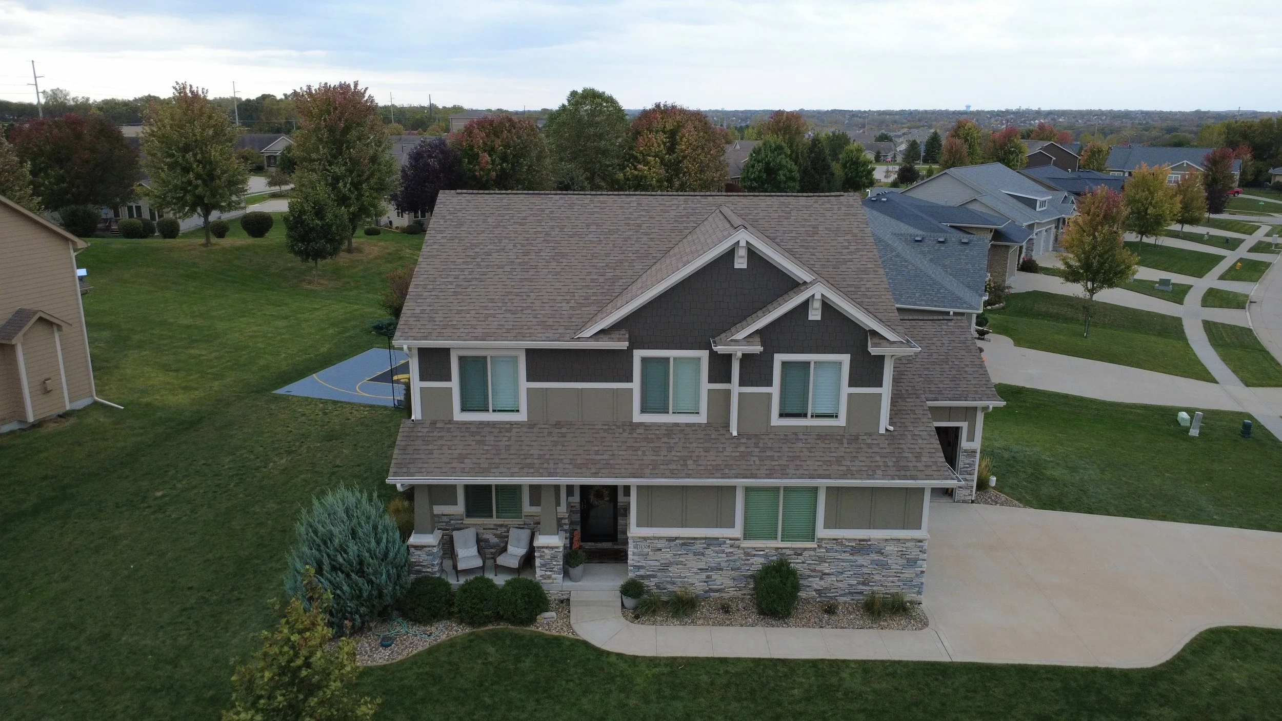 Complete exterior home repaint delivering modern curb appeal and weather protection