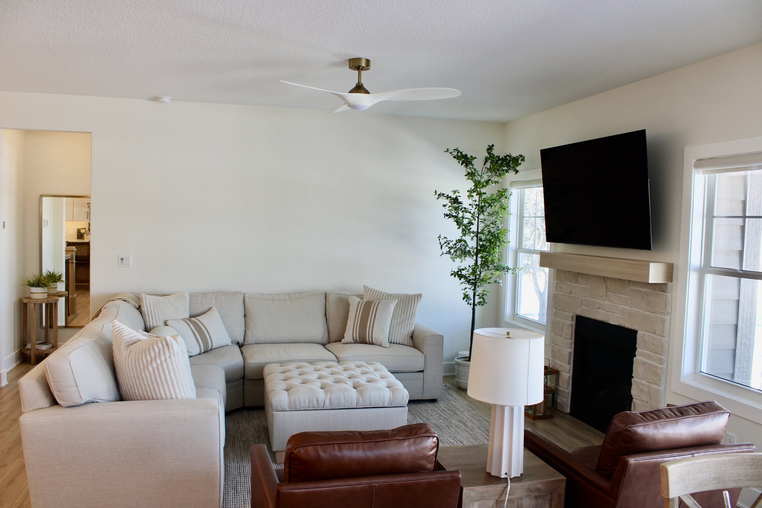 Freshly painted living room with smooth walls, crisp white trim, and clean cut lines

Professional interior painting of living room walls in warm neutral color

Before and after living room painting transformation by Mission Painting

Bright modern l