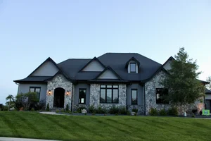 Gray home exterior with black trim by Mission Painting