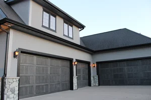Gray home exterior with black trim by Mission Painting