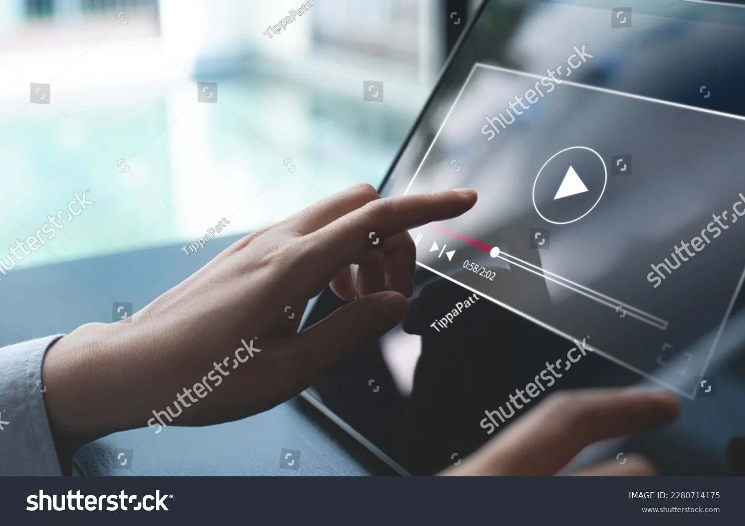 person hitting play on screen