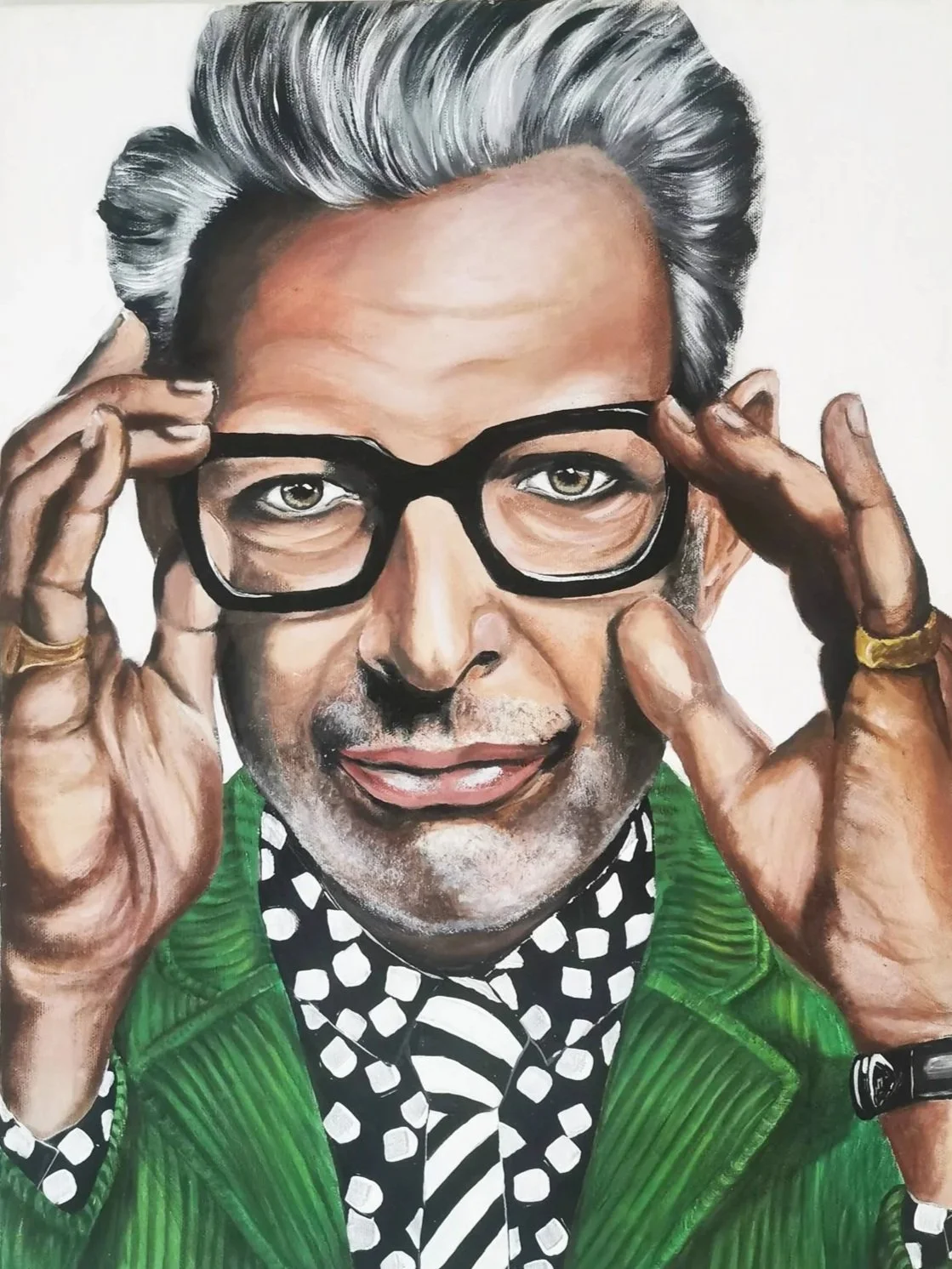 Portrait painting of actor Jeff Goldblum with gray hair, wearing black-rimmed glasses, a green blazer, and a black-and-white polka dot shirt with a striped tie. He is adjusting his glasses with both hands.