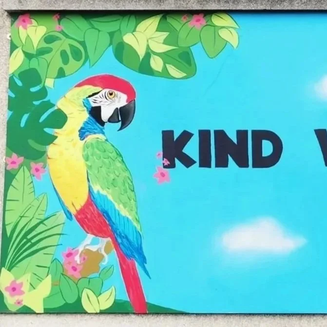 Orlagh Creates Kind words mural is one of four murals for a school playground. I used two parrots talking to each other to represent kind words. I chose for a jungle theme for these murals