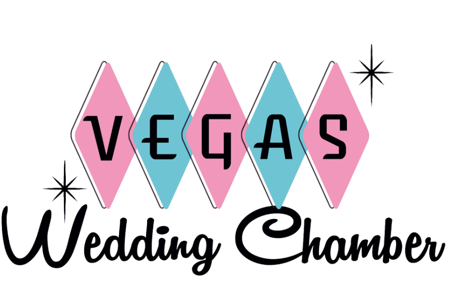 Decorative sign reading 'Vegas Wedding Chamber' with pink and blue diamond shapes and star accents.