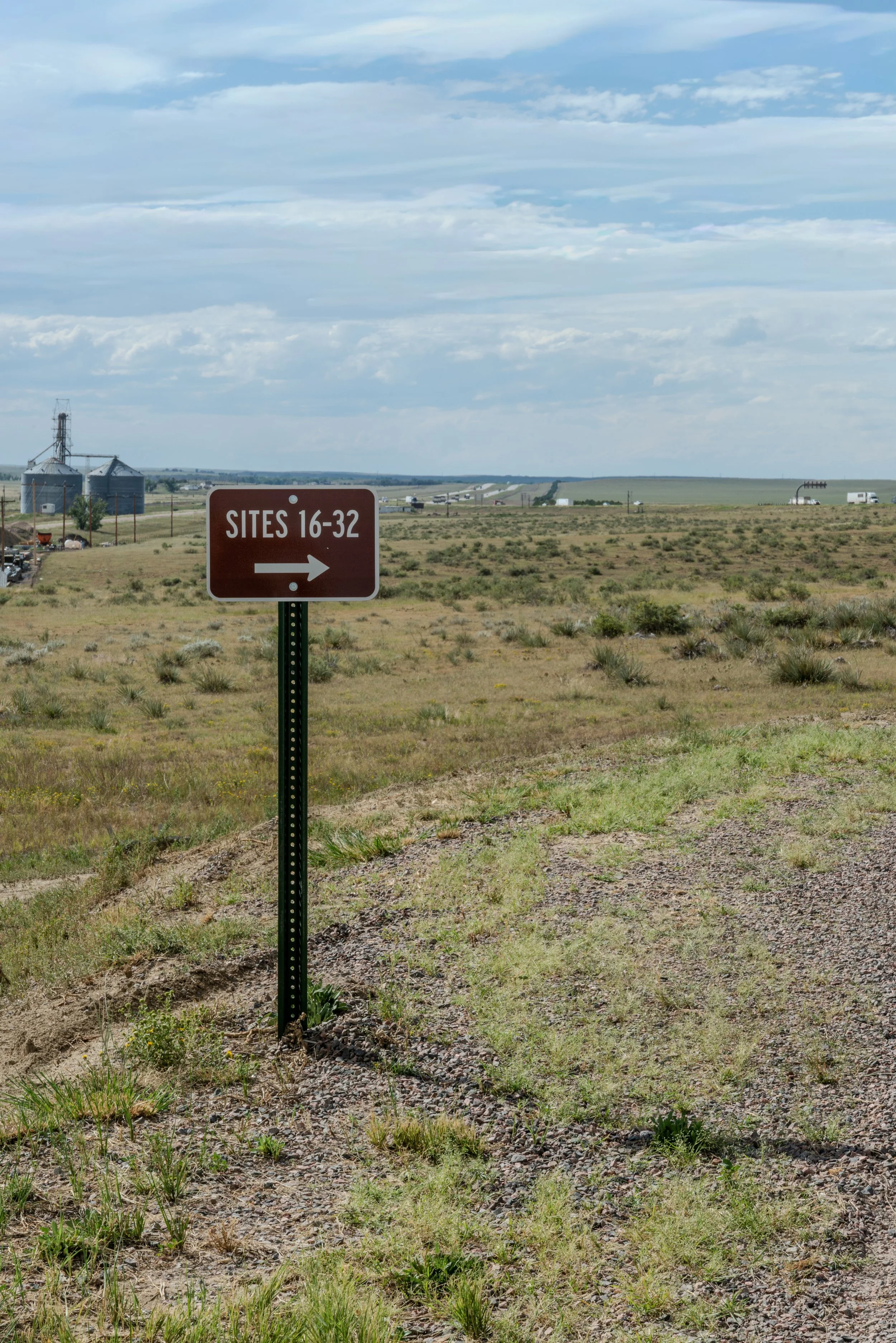 wayfinding sign pointing to sites 16-32