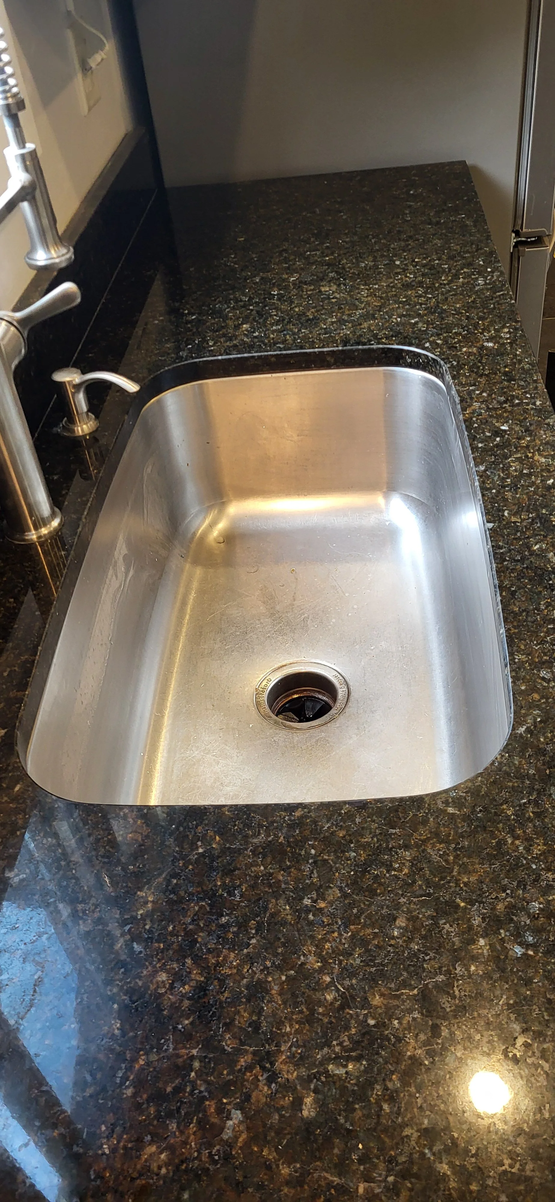 Sink radius completely re-polished and chips repaired.