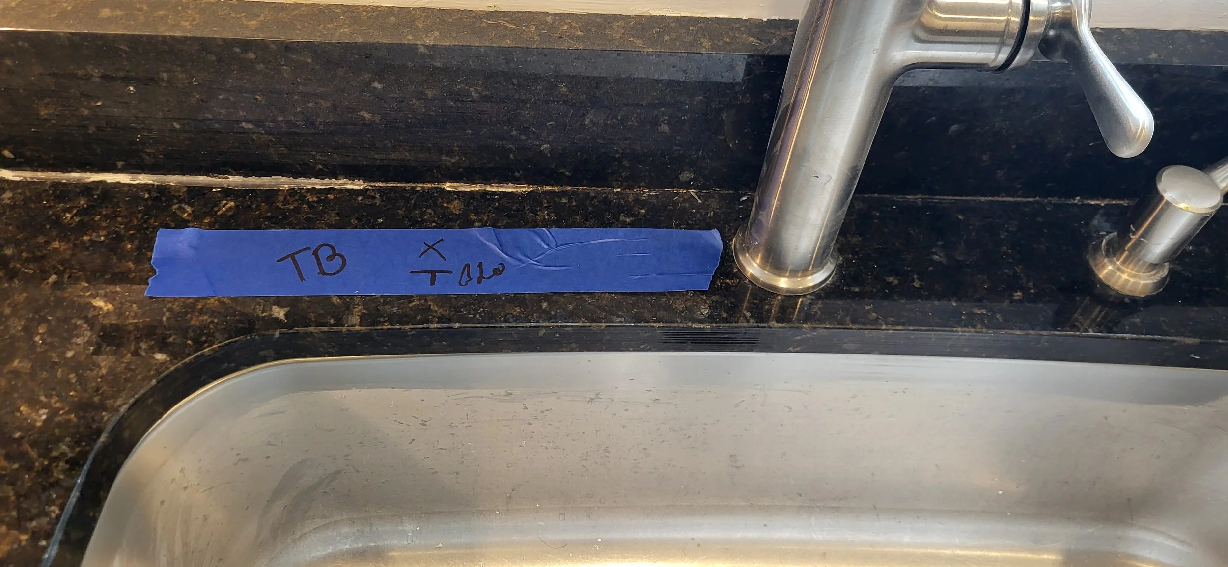 Mine and customer initials of the place of the new hole drilled. 8 inches to the left to match the 8 inches to the right.
