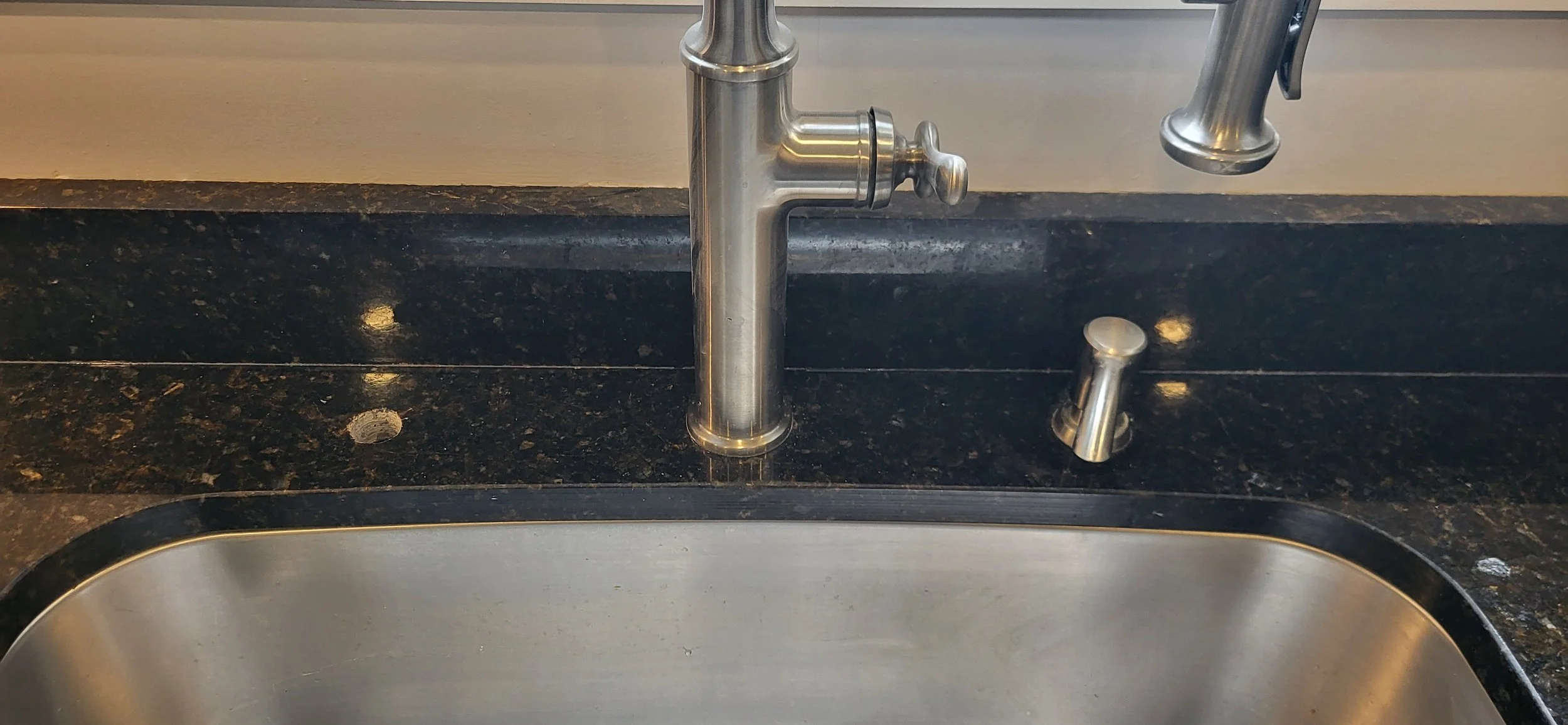 Extra faucet hole drilled.