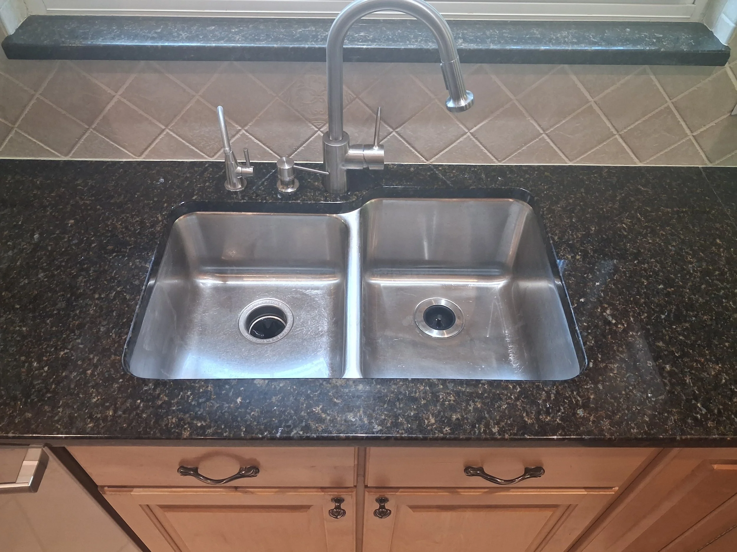 Full picture of the sink all chips fixed and full sink radius re-polished.