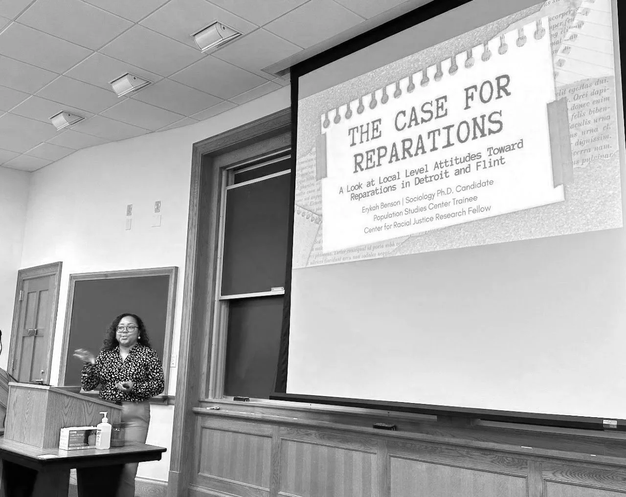 Erykah Benson presenting research on attitudes toward reparations at the University of Michigan Ford School of Public Policy