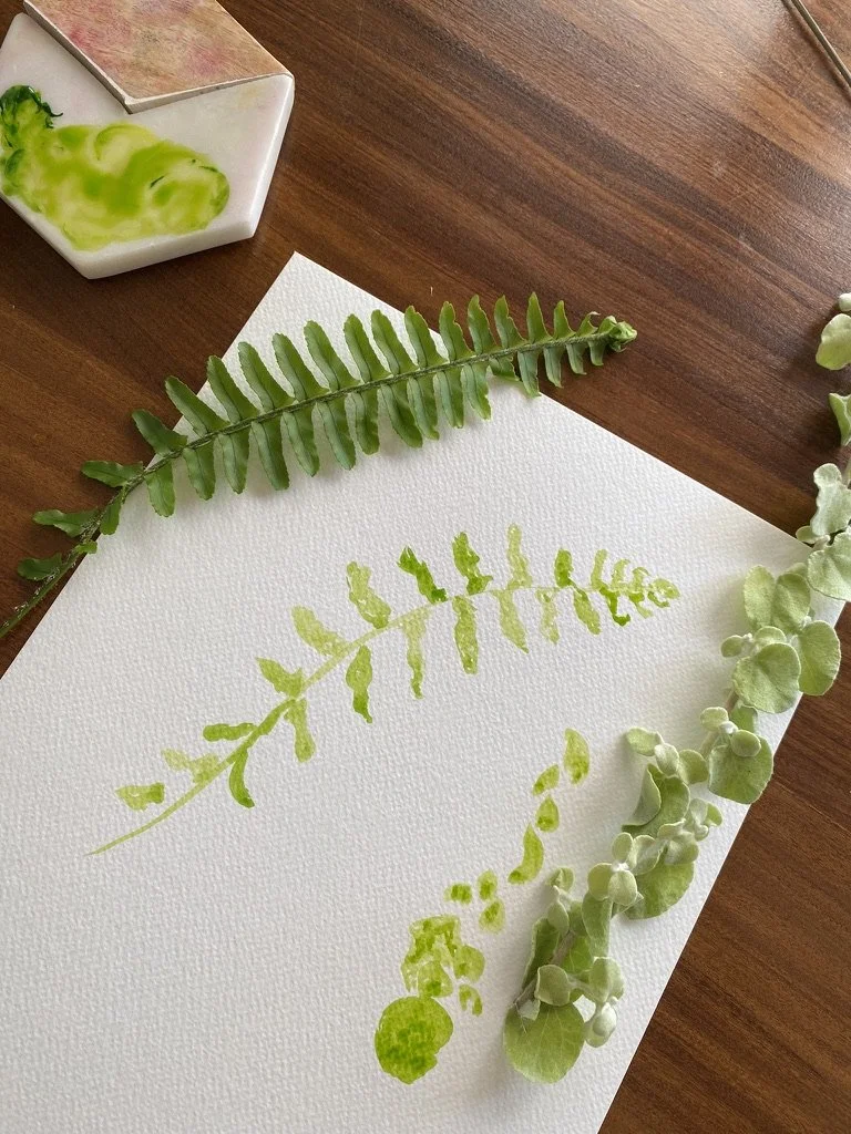 fern and foliage stem on paper with watercolour painted fern frond