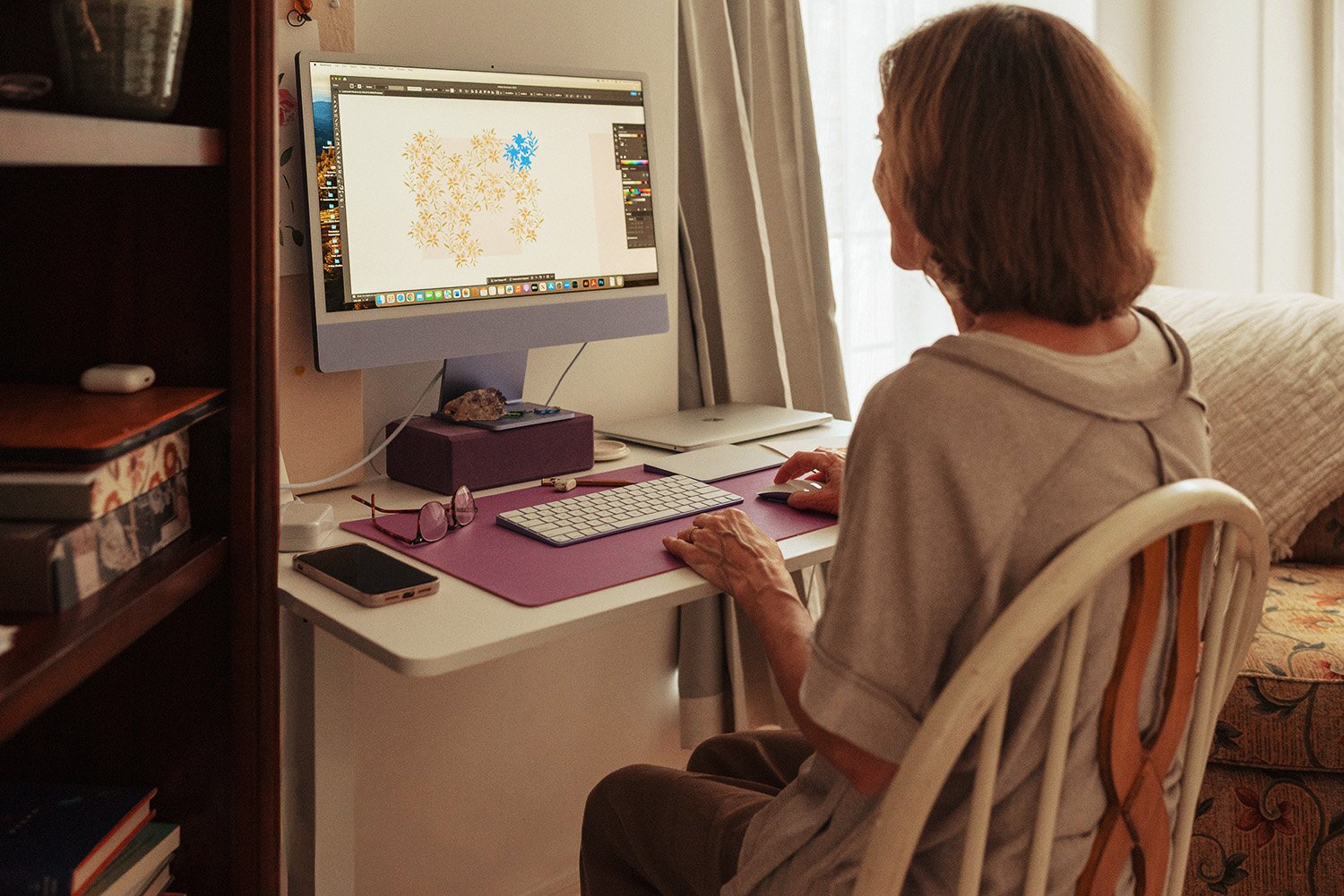 woman sitting at desk working on computer