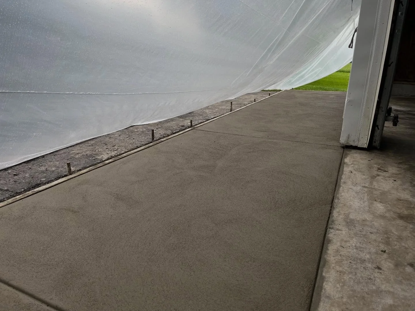 Years of driving over the same spot on blacktop can cause sagging, making it difficult to get in and out of your garage. A concrete apron is an effective solution that also enhances the appearance of your home. For this project, we cut and removed th