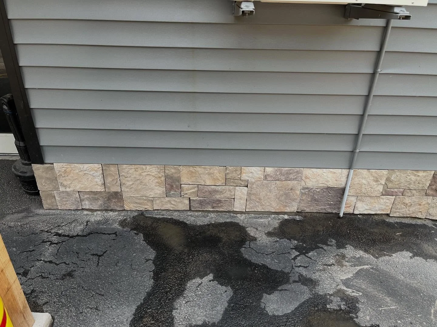 This business owner reached out to us for help matching and repairing stone veneer that had fallen off their building after a harsh winter. We were able to source a matching stone, cut it to fit, and adhere it in place&mdash;restoring the building to