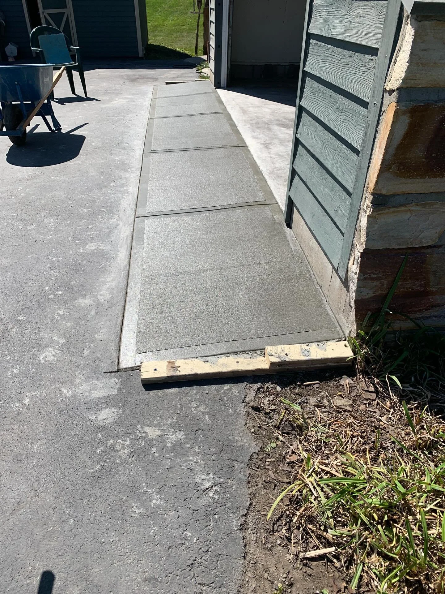After completing the floor project, the homeowner asked us to add a concrete apron to make driving in and out of the garage easier. An apron helps protect the leading edge of a garage floor by preventing chipping and damage at the driveway transition