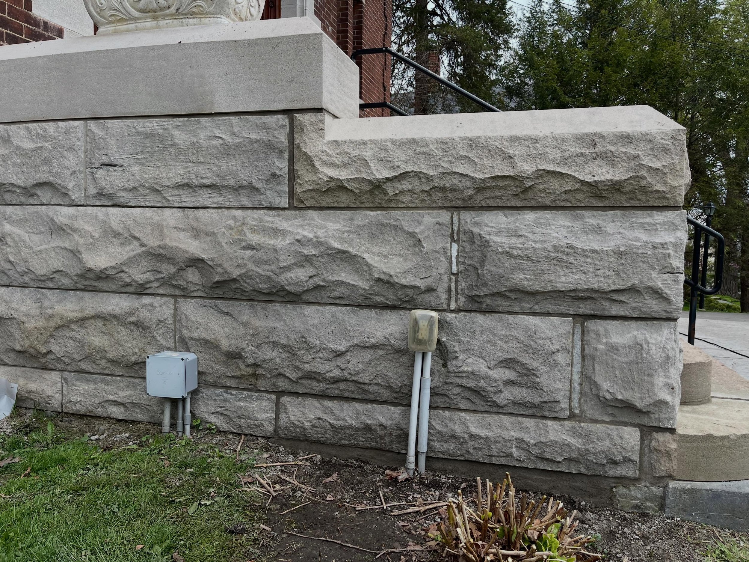 For phase two of this project, after resetting the stones, we chipped out all remaining deteriorated mortar along the staircase end caps and tuckpointed the joints using a bonding agent-enhanced mortar for added durability. We then removed the weathe