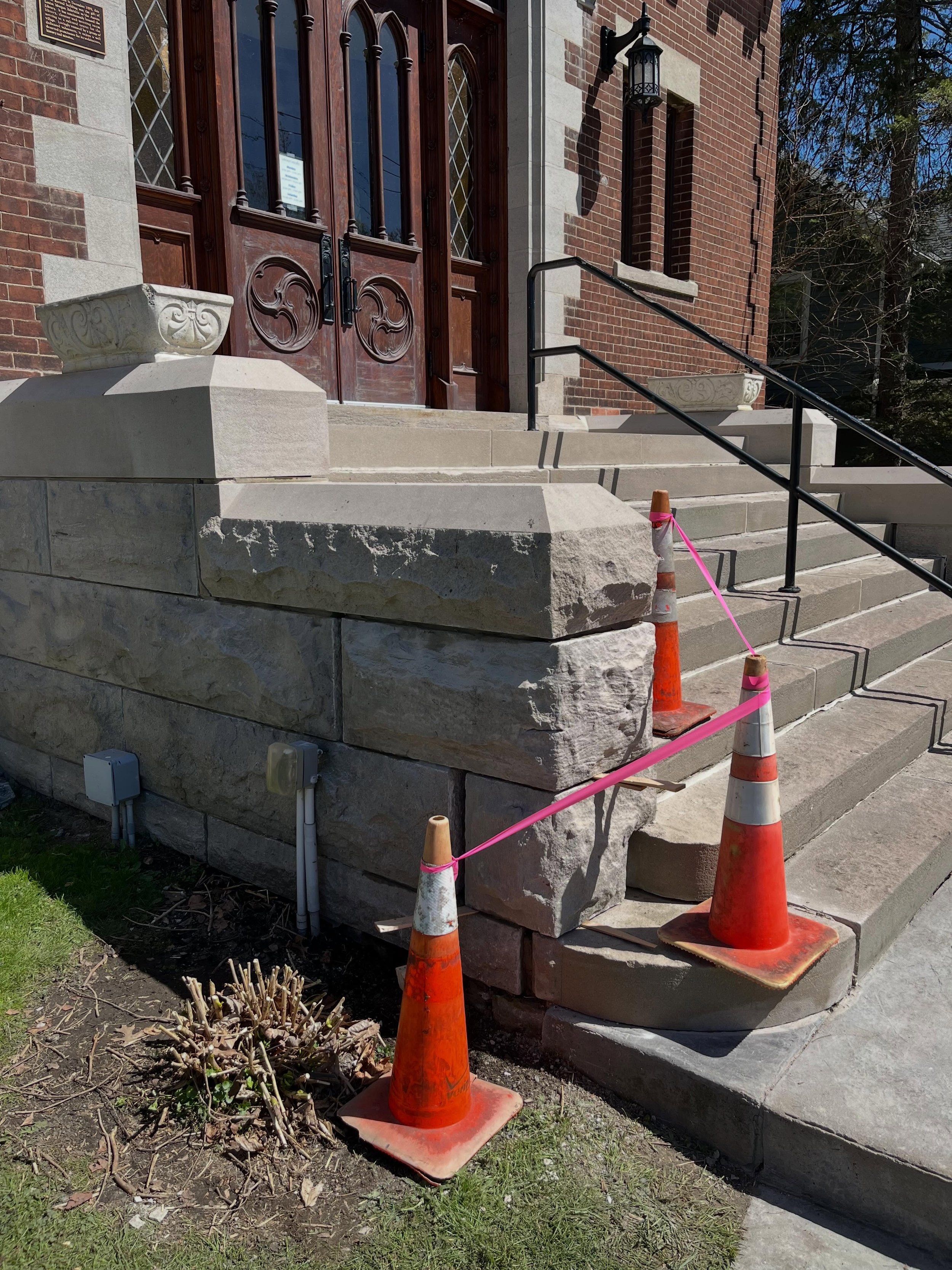 New York winters can take a serious toll on masonry once water penetrates beneath the surface. This is part one of a two-phase repair for the @aurorafreelibrary , where the large stone entryway staircase had heaved over the winter. We braced and lift
