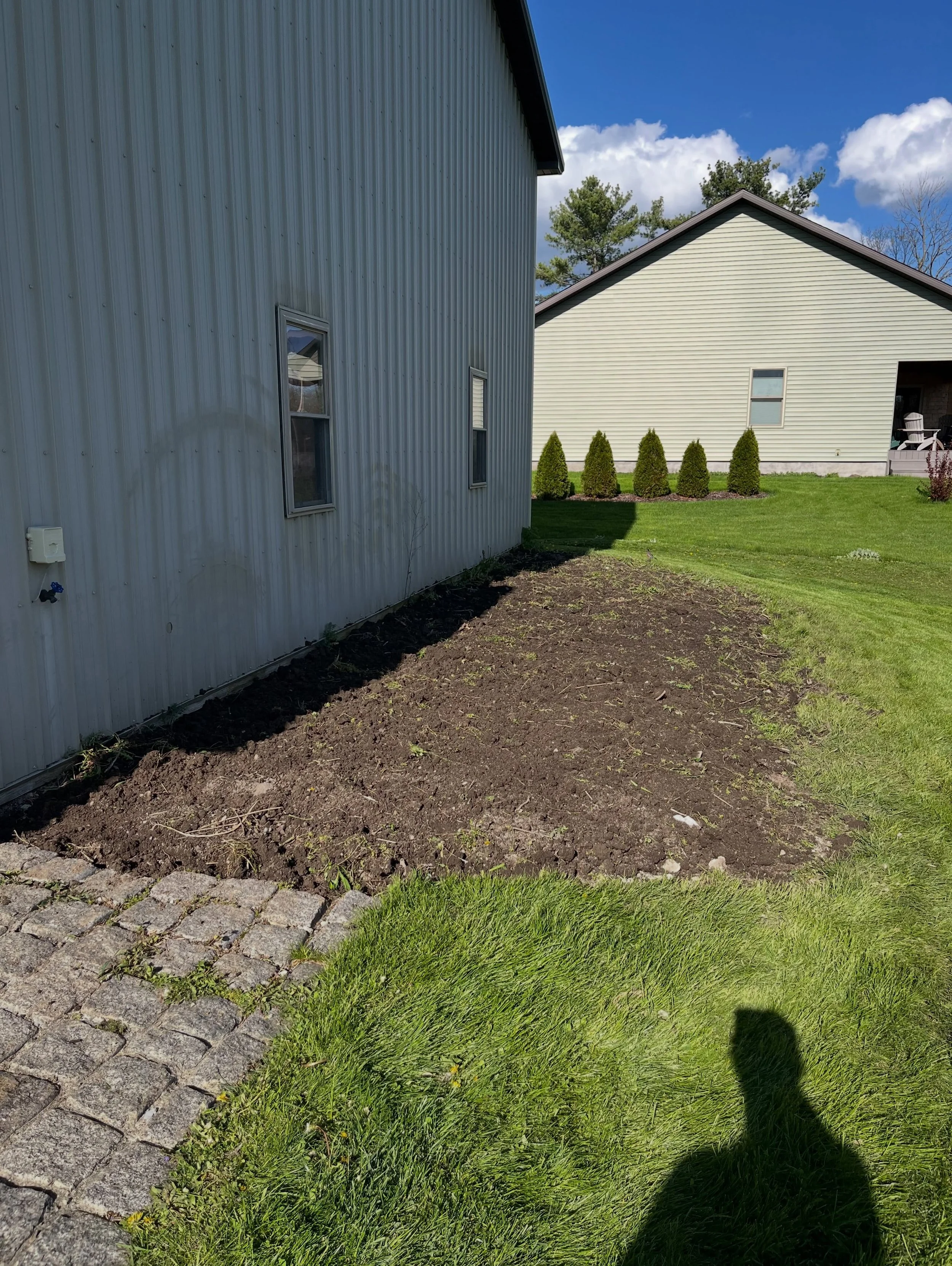 We helped this homeowner remove and dispose of an overgrown, deteriorated, and unsightly masonry-bordered garden and walkway. The project began by breaking up and removing solid, core-filled concrete blocks and granite pavers. We then hand-loaded thr