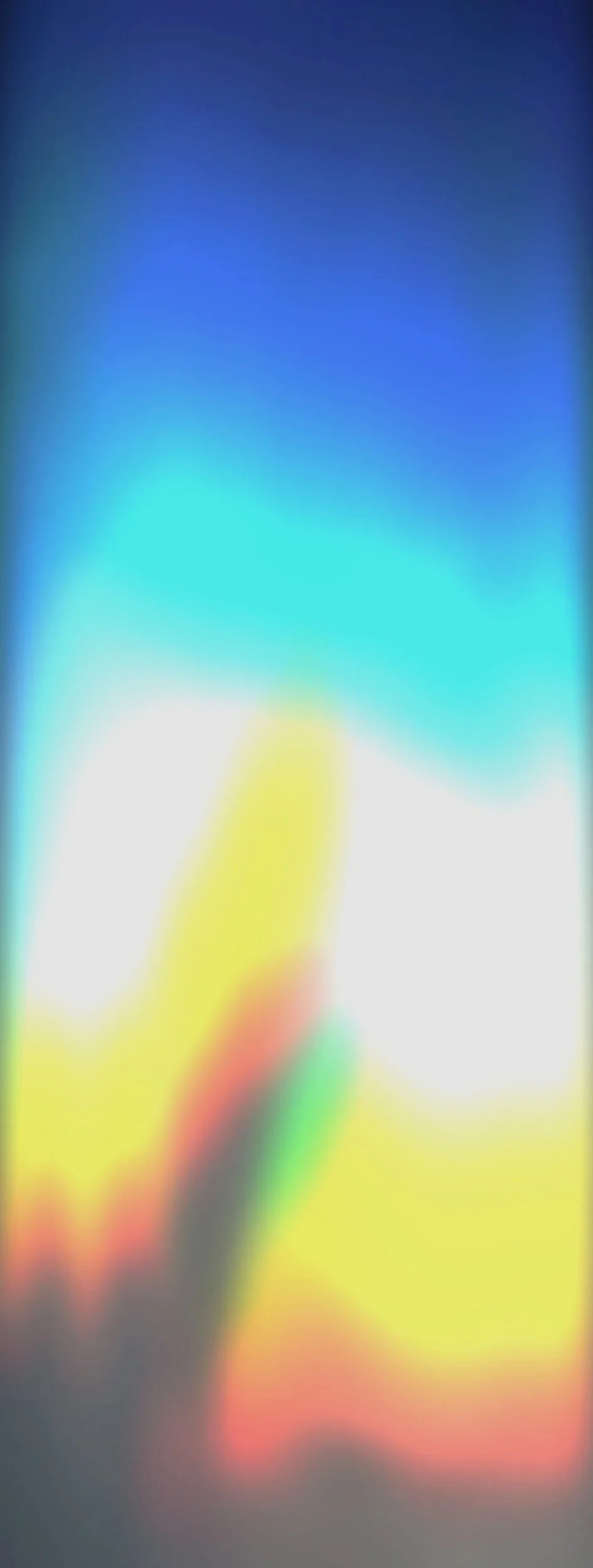 A moving aura of hues of burnt siena, yellow, green, blue and white for Middle Frequency.