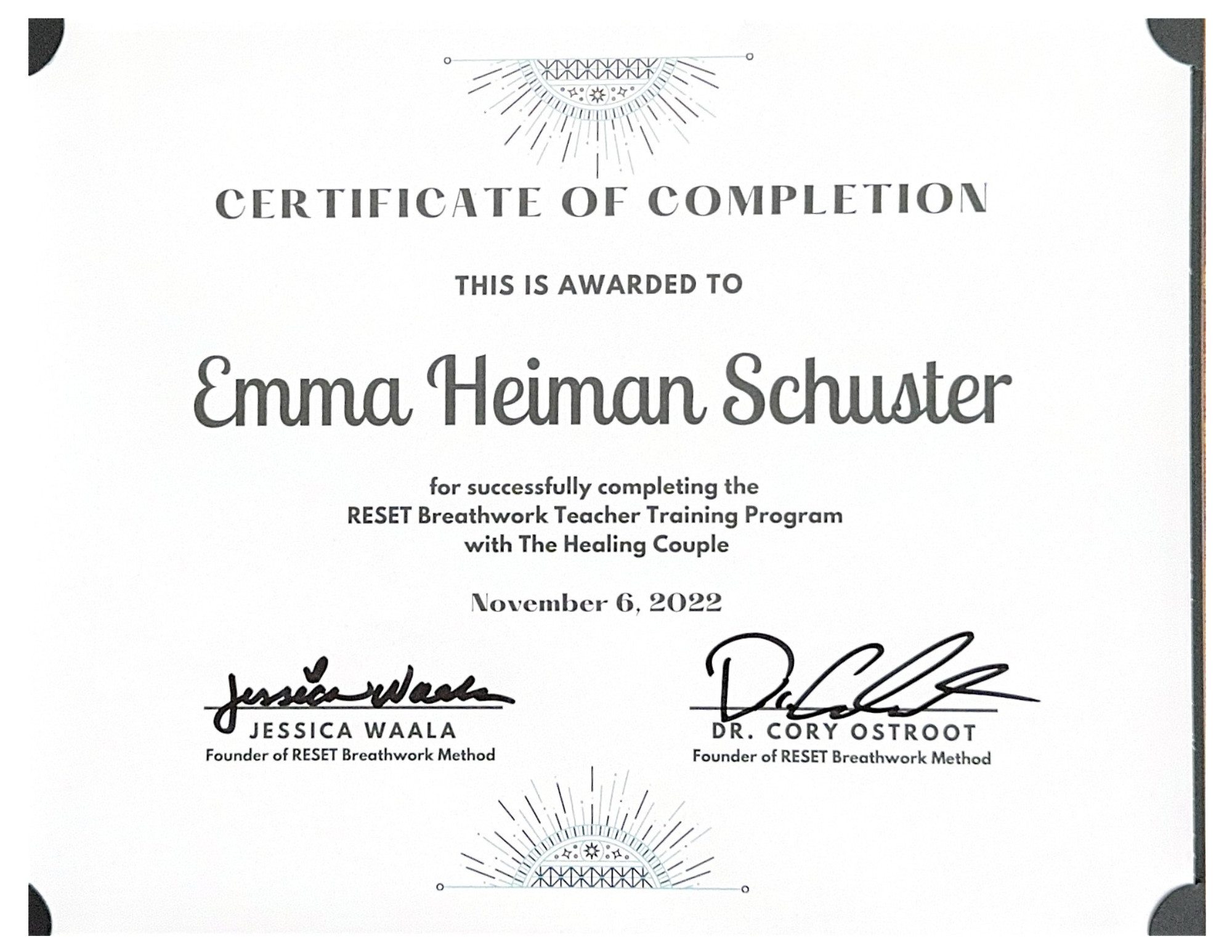 Certificate of Completion awarded to Emma Heiman Schuster for completing RESET Breathwork Teacher Training with The Healing Couple, dated November 6, 2022, signed by Jessica Waala and Dr. Cory Ostroot.