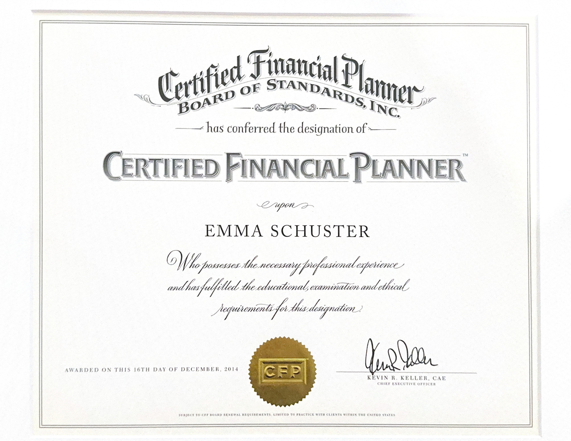 A certificate awarded by the Board of Standards, Inc., recognizing Emma Schuster as a Certified Financial Planner, signed by Kevin R. Keller, with a gold seal at the bottom.