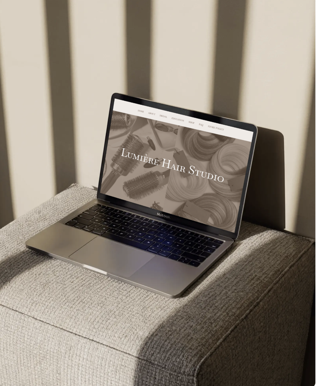 Lumière Hair Studio luxury hair salon website designed by Clear Canvas Design, a women-owned Wix and Squarespace web design agency in Virginia, displayed on a MacBook laptop.