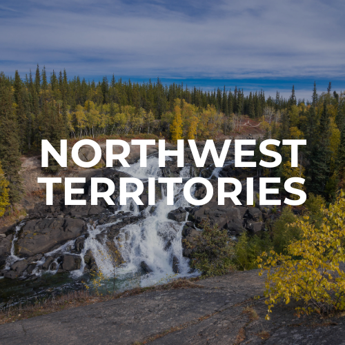 Scenic view of a waterfall with a forest of tall evergreen trees and colorful autumn foliage under a cloudy sky, featuring text 'Northwest Territories' in large white letters.