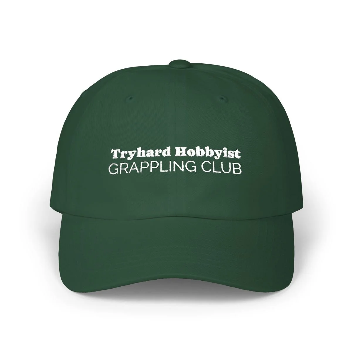 Green baseball cap with white embroidered text, reading "Tryhard Hobbyist GRAPPLING CLUB."