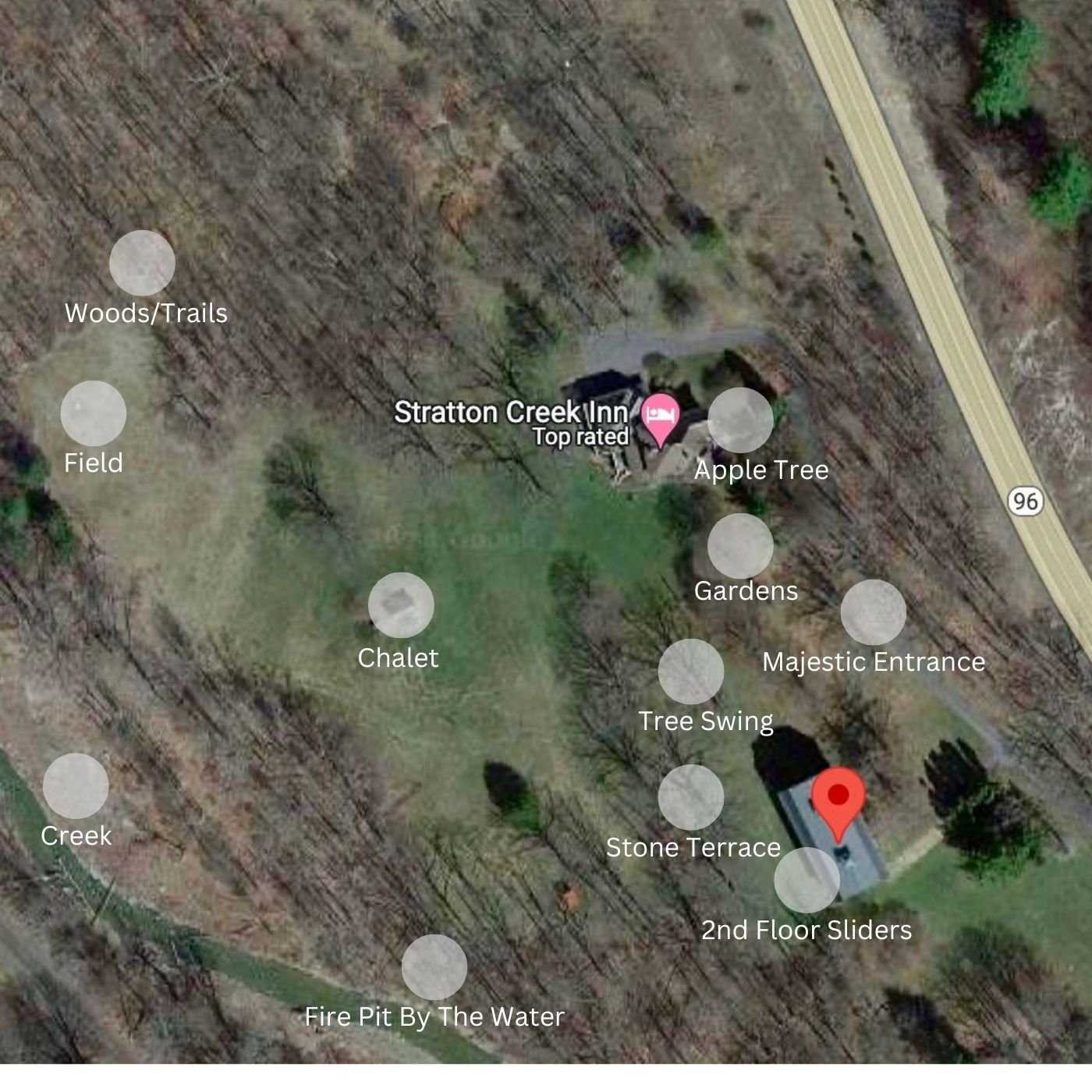 Aerial view of Stratton Creek Inn area showing labeled features such as woods, fields, a chalet, creek, apple tree, gardens, tree swing, stone terrace, and fire pit. A road labeled Highway 96 is also visible.
