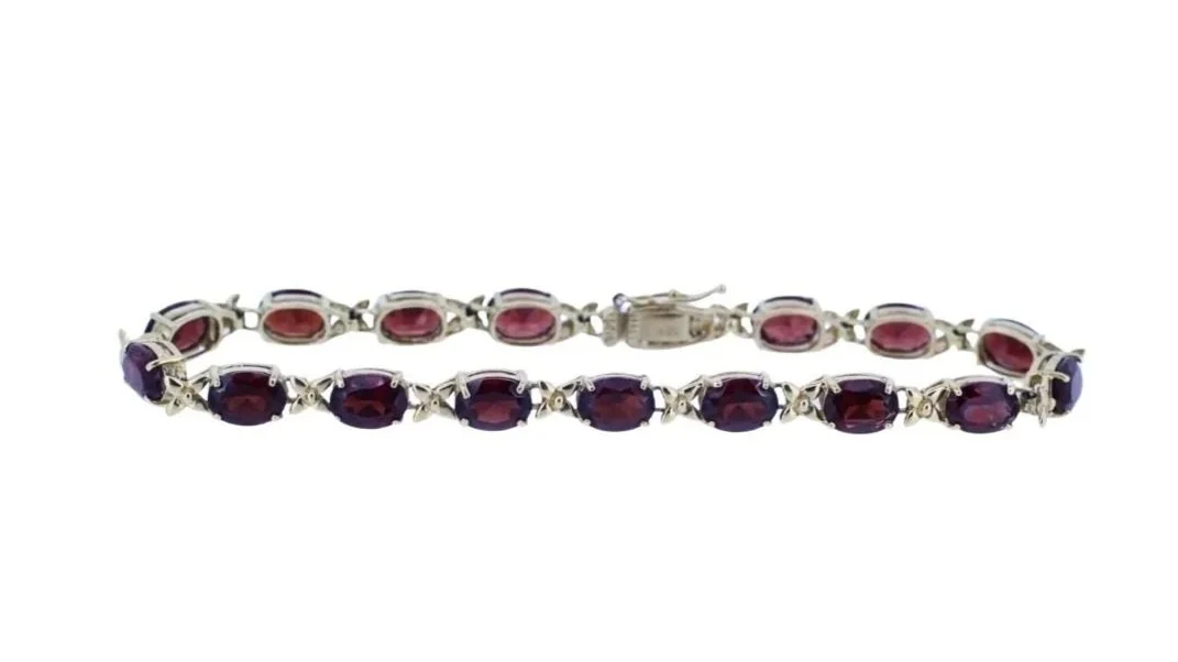 14K Yellow Gold and Oval Faceted Garnet Bracelet.