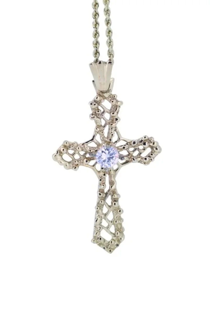 14K Yellow Gold and Round Brilliant Cut Diamond Cross Pendant, on a 16 inch chain.