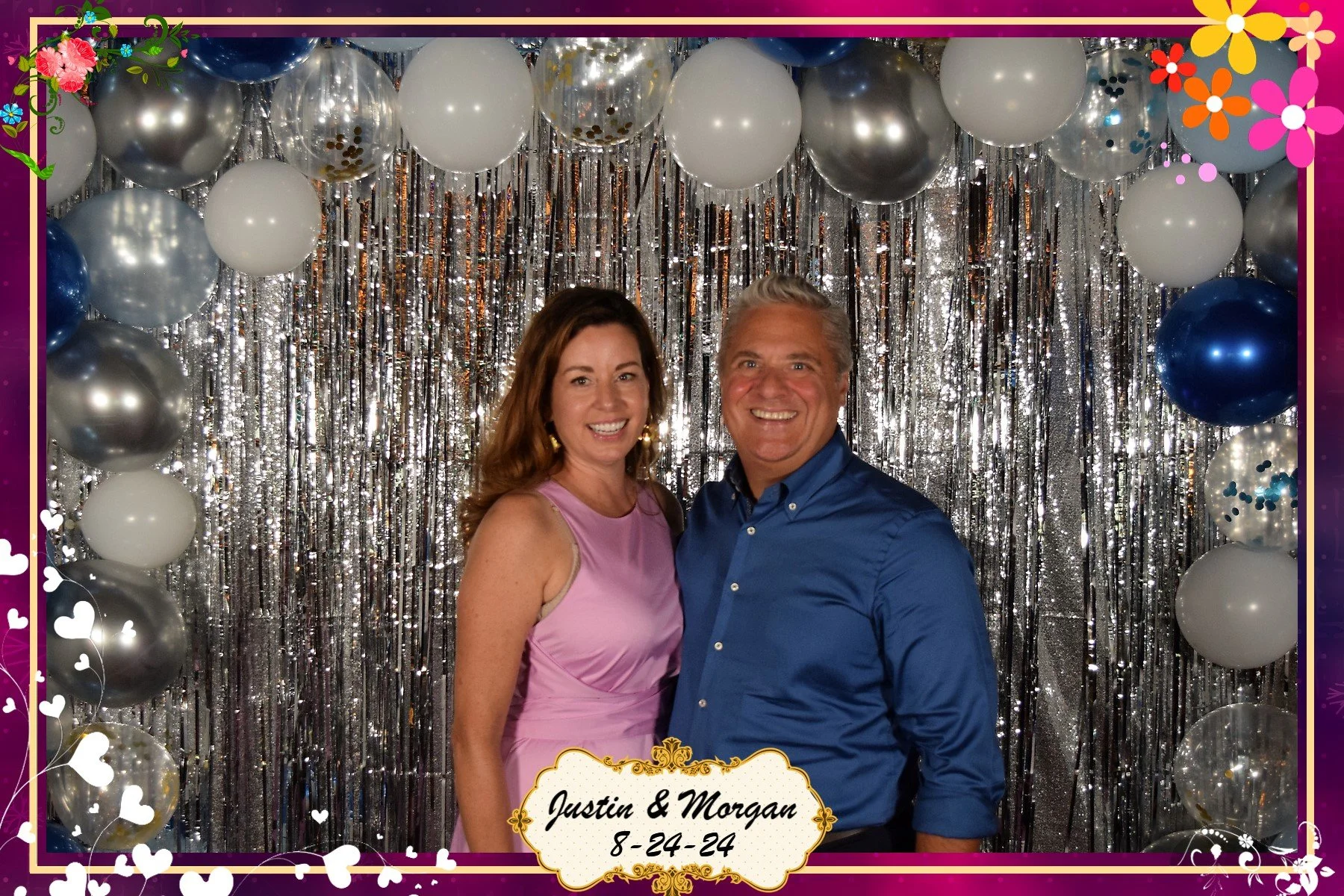 People in front of a photobooth backdrop.